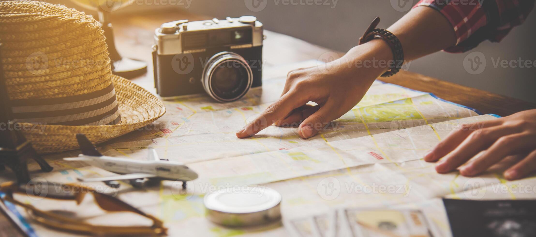 Travelers are planning a trip by searching the route on the map and searching for information on the internet. photo