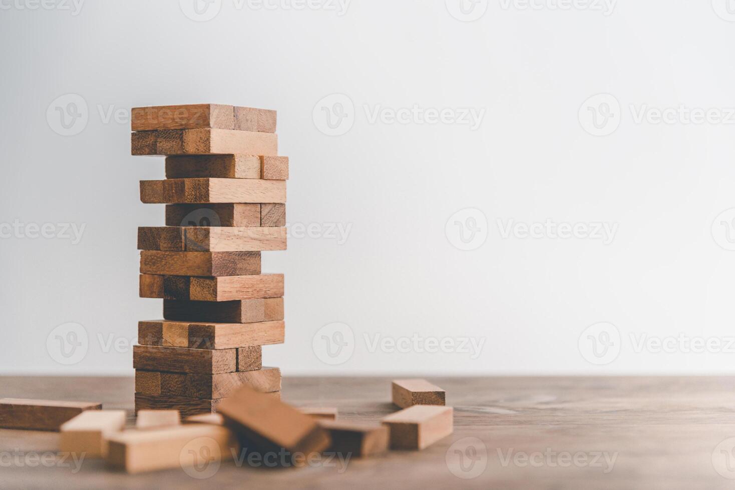 game drew to a wooden block from the tower.concept business risks in the business. Requires planning meditation must be careful in deciding to reduce the risk in the business. photo