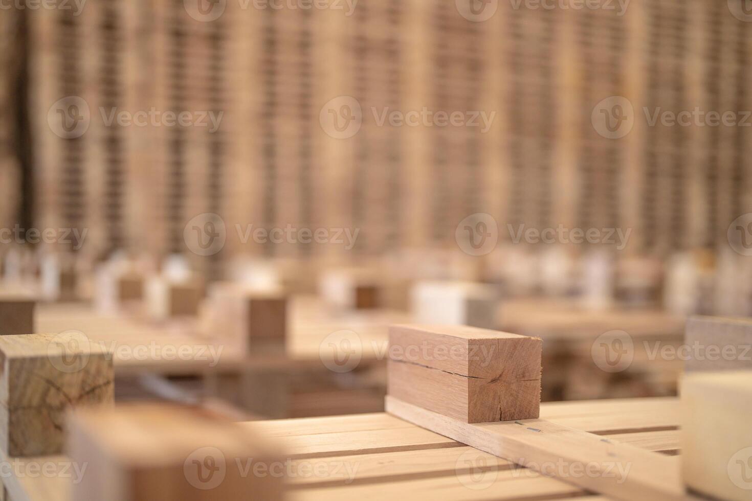 background of pattern wood section. Grid of wood squares. the raw of material timber on stack. photo