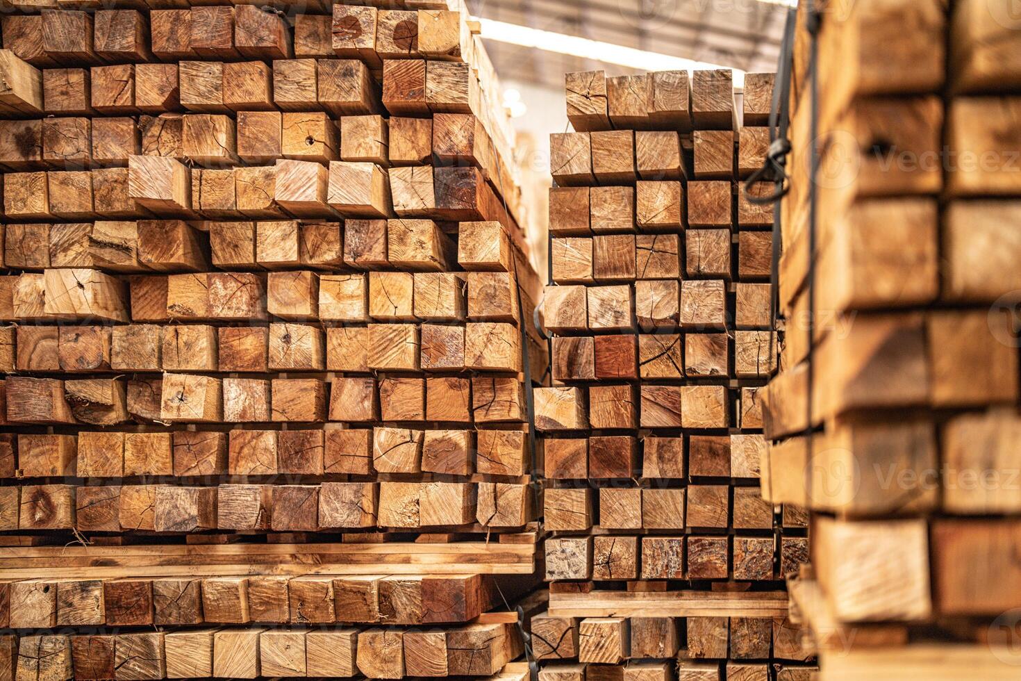background of pattern wood section. Grid of wood squares. the raw of material timber on stack. photo
