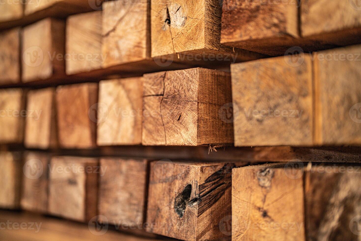background of pattern wood section. Grid of wood squares. the raw of material timber on stack. photo