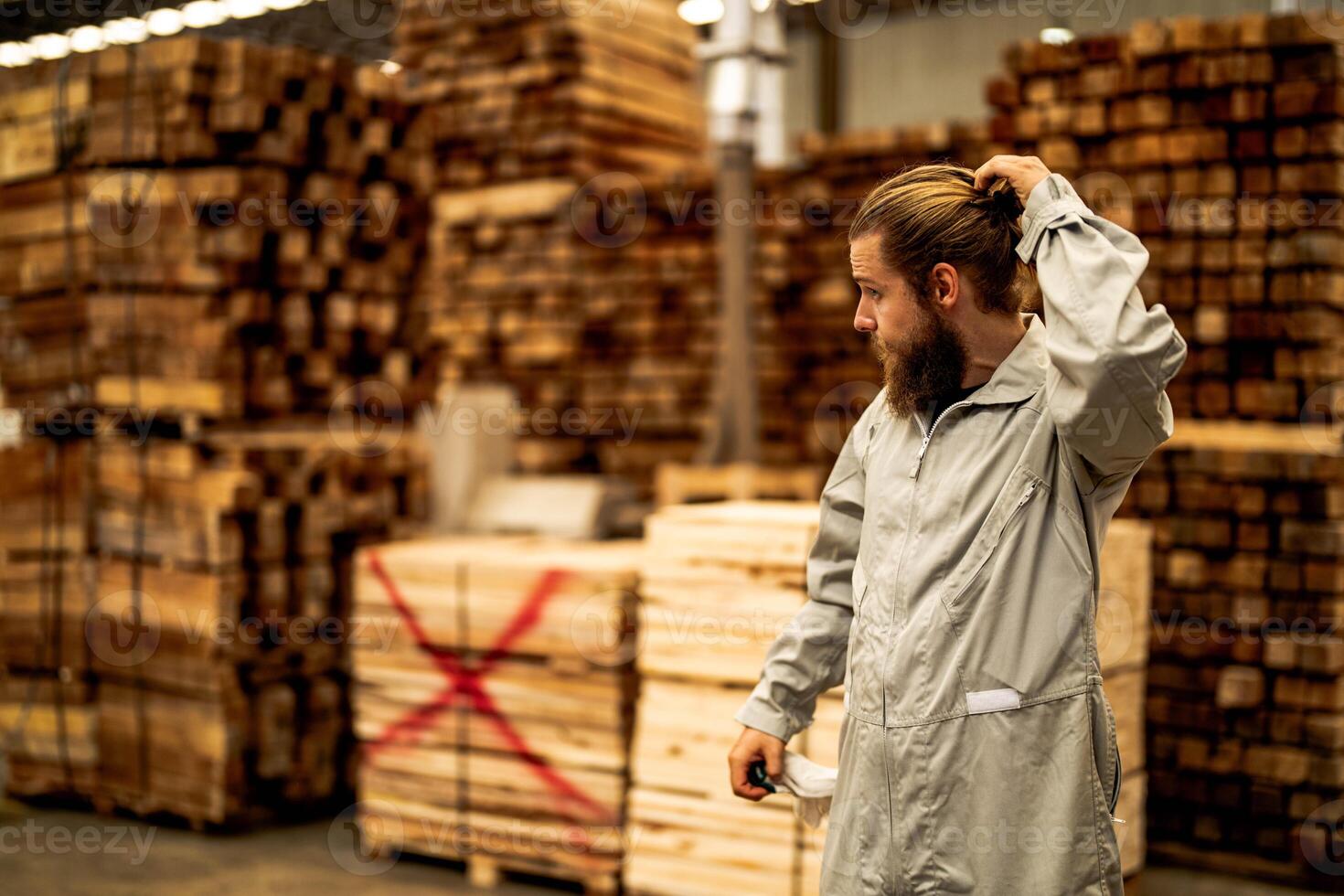 man workers engineering standing with confidence with working suite dress and hand glove in front machine. Concept of smart industry worker operating. Wood factory produce wood palate. photo