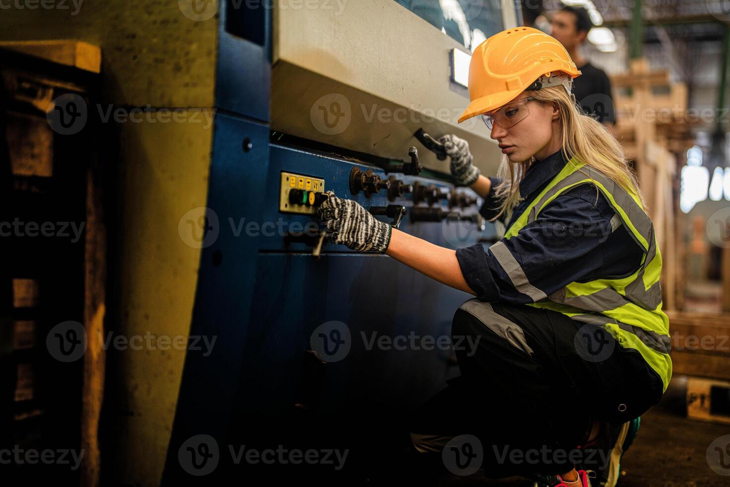 Factory engineer woman standing confidence to control panel switch. Worker works at heavy machine at industry factory. with machinery equipment plant technology. smart industry worker operating. photo