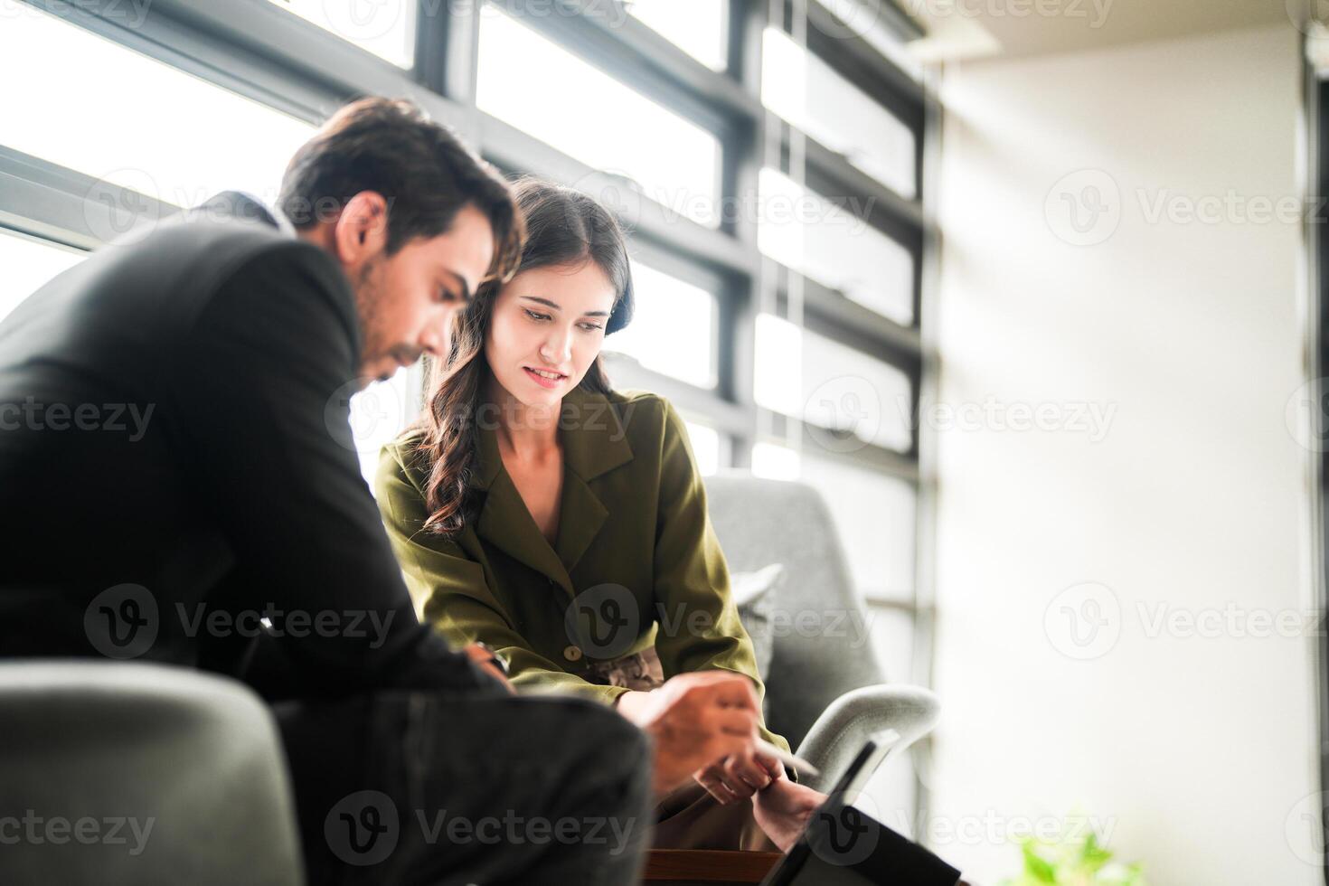 Business people having fun and chatting at workplace office. Male and female colleague enjoy meeting at co working space. colleagues discussing about the project in the office. photo