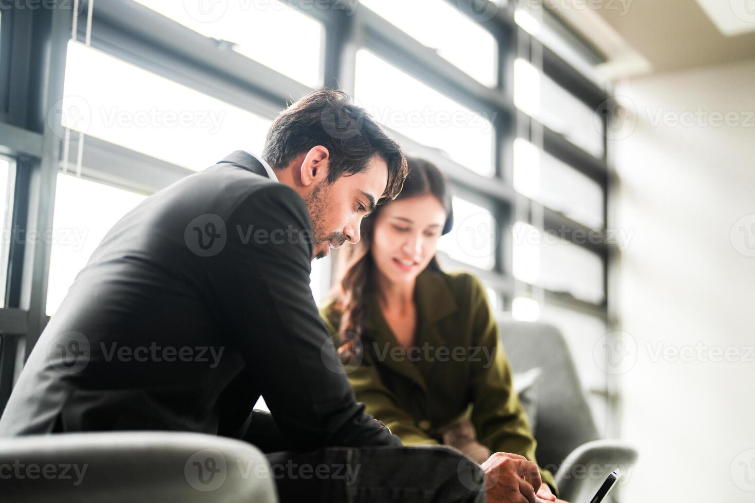 Business people having fun and chatting at workplace office. Male and female colleague enjoy meeting at co working space. colleagues discussing about the project in the office. photo