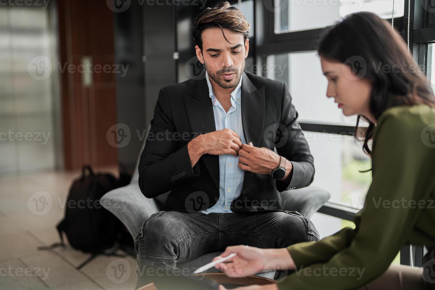 Business people having fun and chatting at workplace office. Male and female colleague enjoy meeting at co working space. colleagues discussing about the project in the office. photo