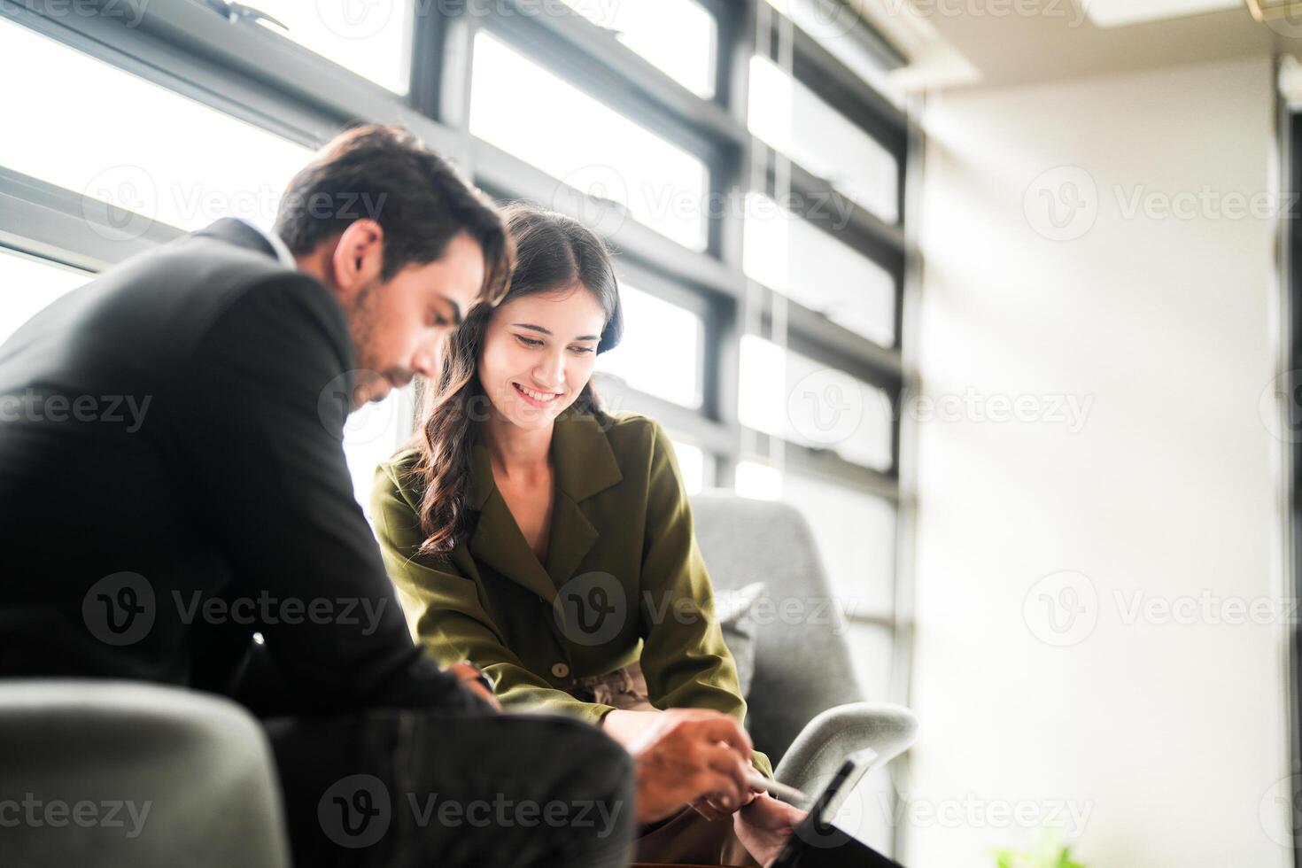 Business people having fun and chatting at workplace office. Male and female colleague enjoy meeting at co working space. colleagues discussing about the project in the office. photo