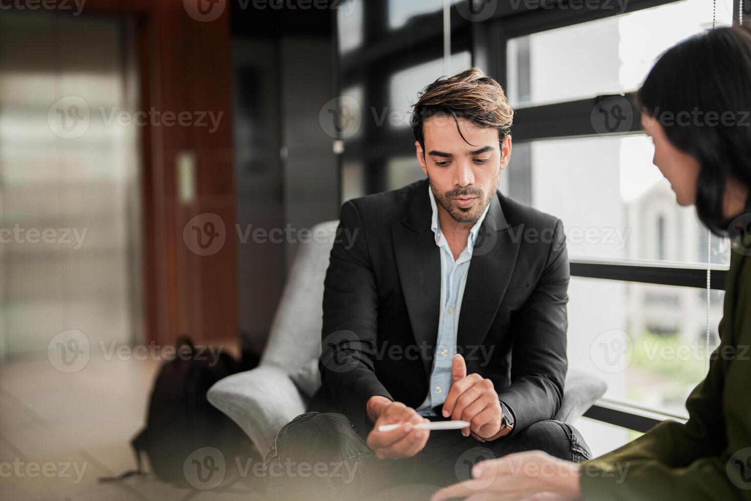 Business people having fun and chatting at workplace office. Male and female colleague enjoy meeting at co working space. colleagues discussing about the project in the office. photo