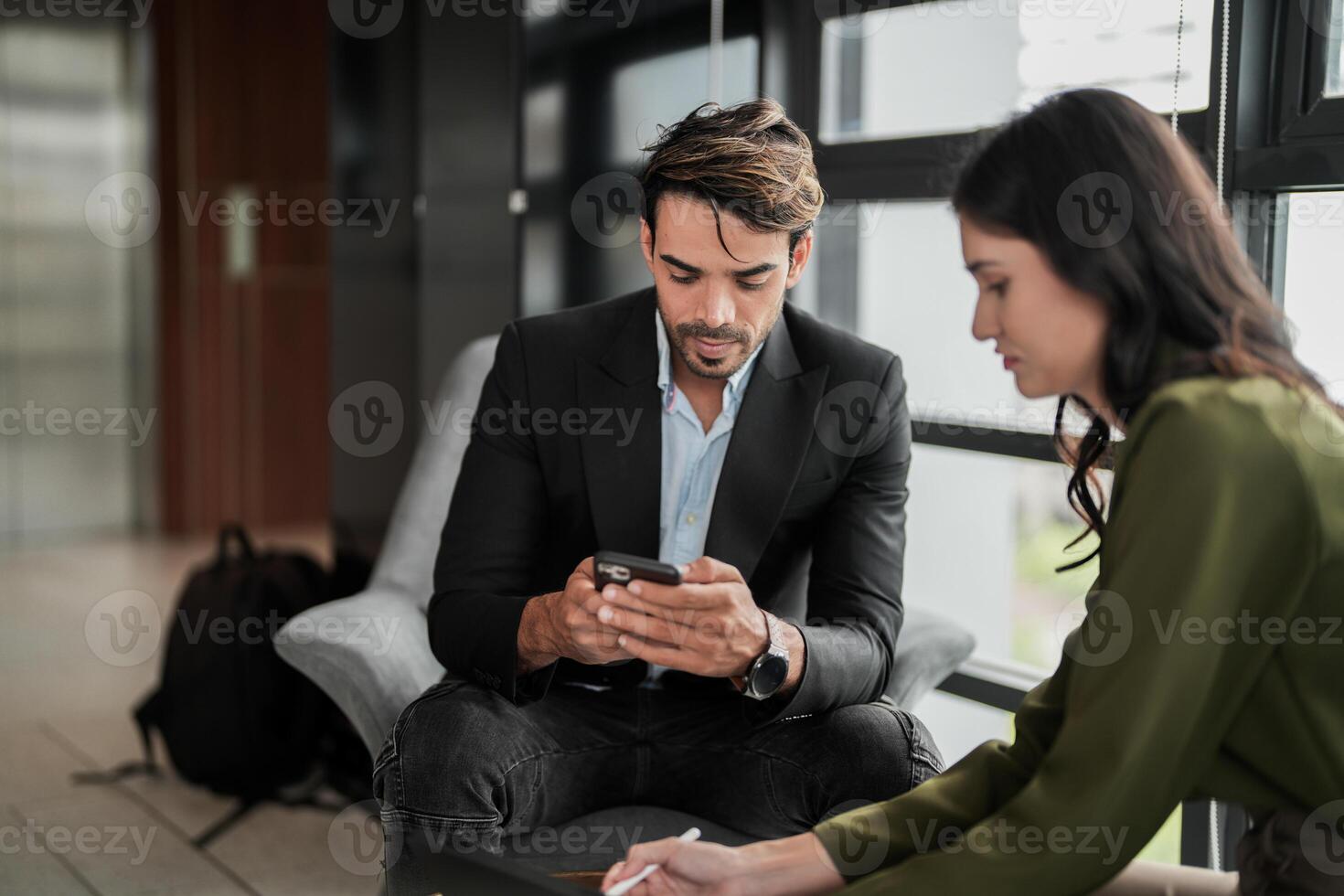 Business people having fun and chatting at workplace office. Male and female colleague enjoy meeting at co working space. colleagues discussing about the project in the office. photo