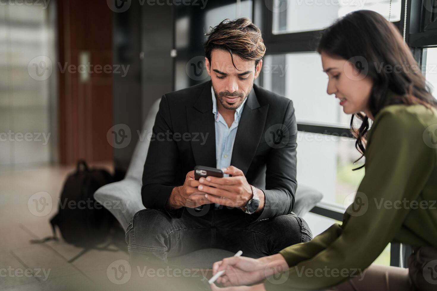 Business people having fun and chatting at workplace office. Male and female colleague enjoy meeting at co working space. colleagues discussing about the project in the office. photo