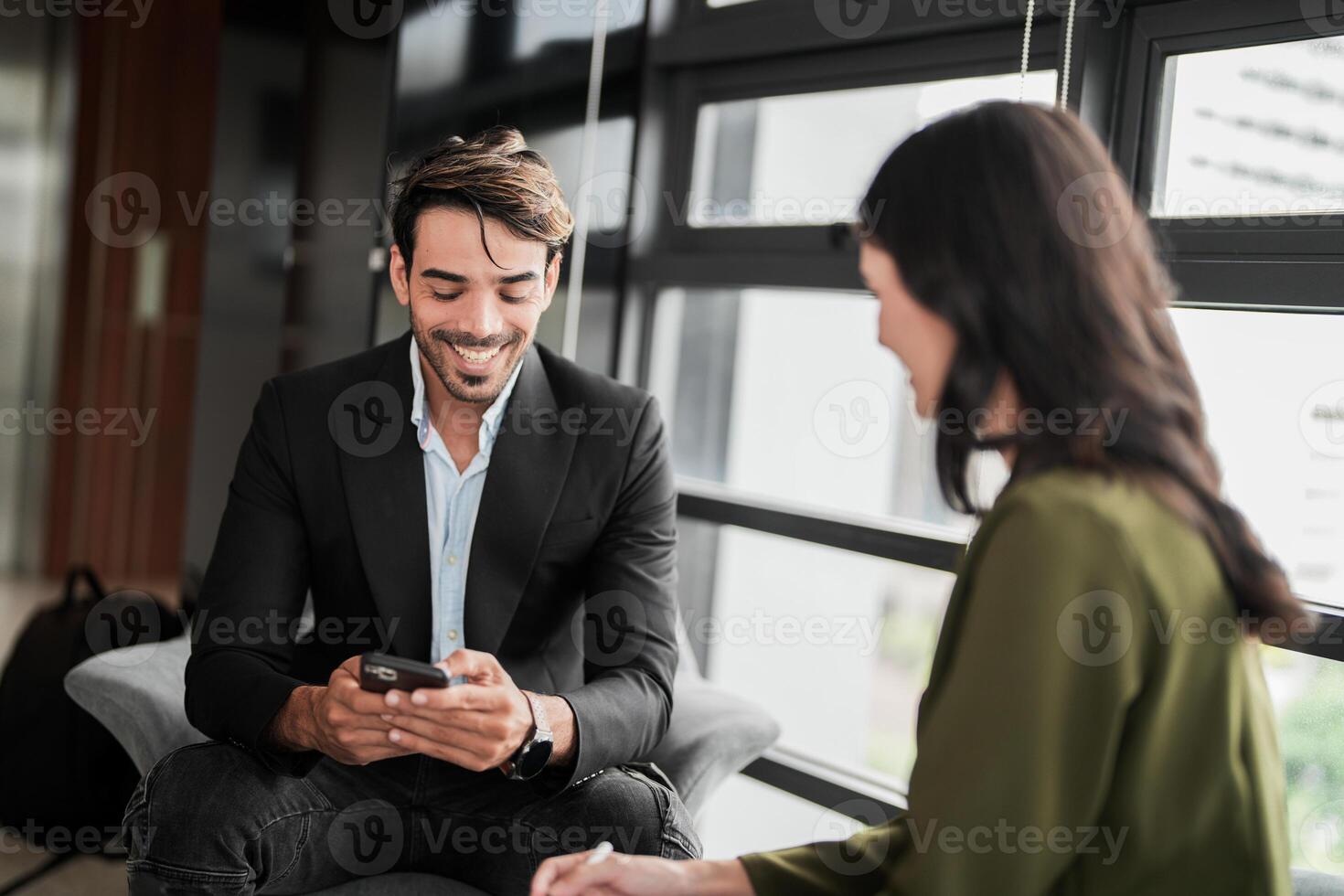 Business people having fun and chatting at workplace office. Male and female colleague enjoy meeting at co working space. colleagues discussing about the project in the office. photo