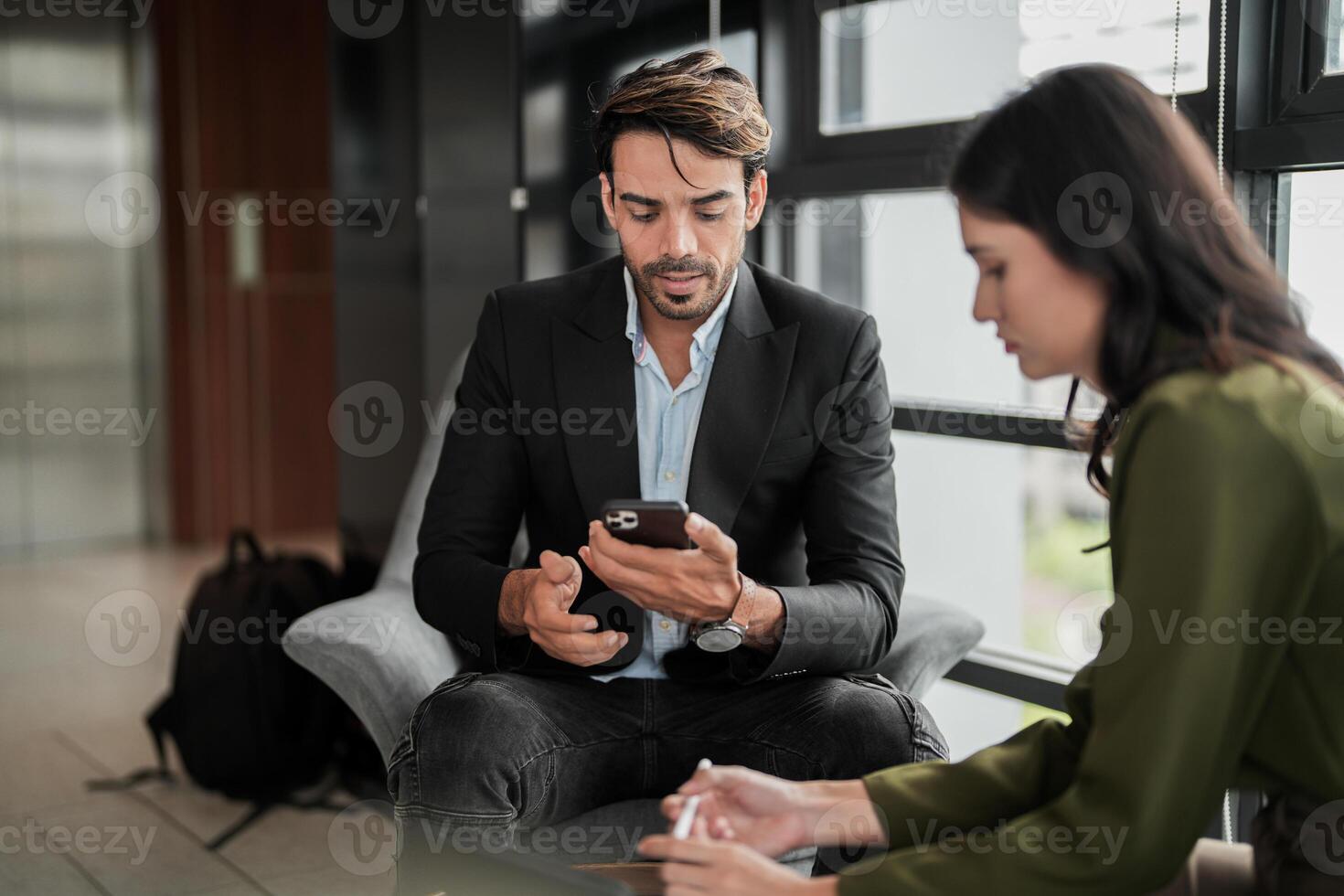 Business people having fun and chatting at workplace office. Male and female colleague enjoy meeting at co working space. colleagues discussing about the project in the office. photo