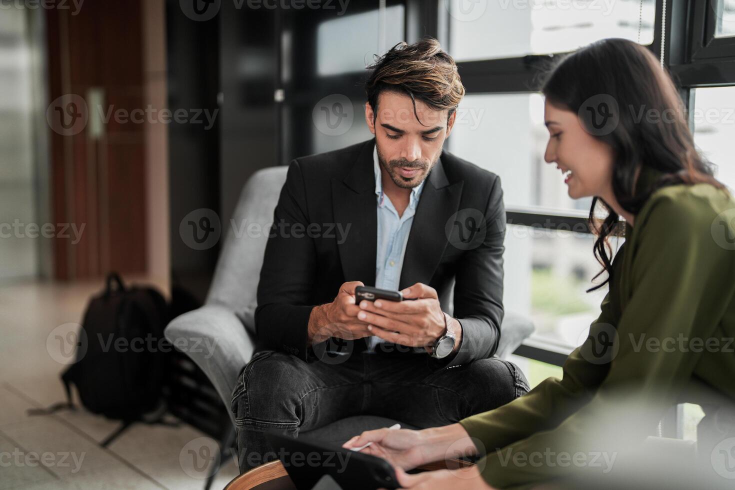 Business people having fun and chatting at workplace office. Male and female colleague enjoy meeting at co working space. colleagues discussing about the project in the office. photo