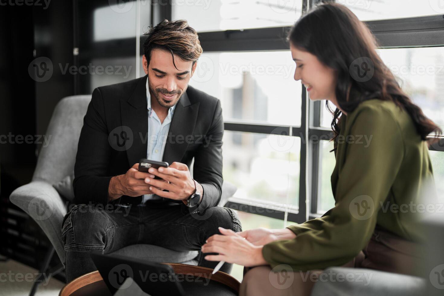 Business people having fun and chatting at workplace office. Male and female colleague enjoy meeting at co working space. colleagues discussing about the project in the office. photo