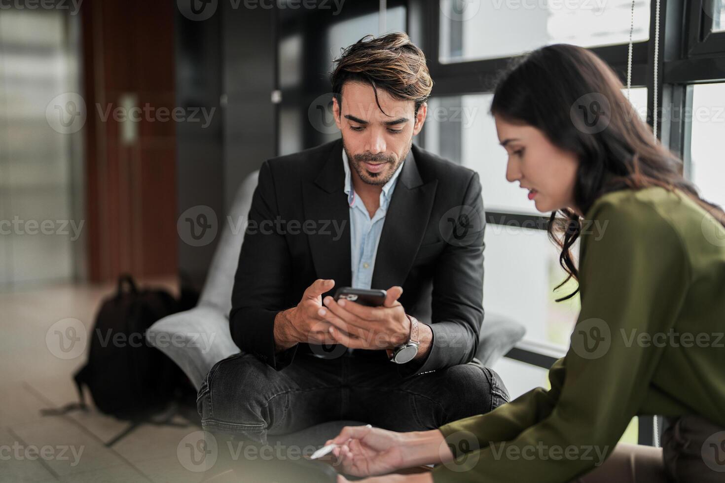 Business people having fun and chatting at workplace office. Male and female colleague enjoy meeting at co working space. colleagues discussing about the project in the office. photo