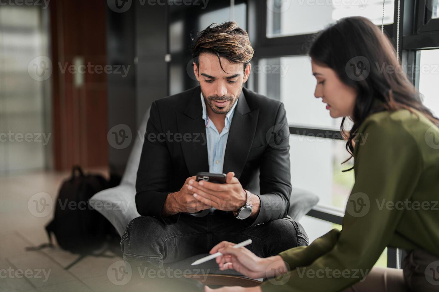 Business people having fun and chatting at workplace office. Male and female colleague enjoy meeting at co working space. colleagues discussing about the project in the office. photo