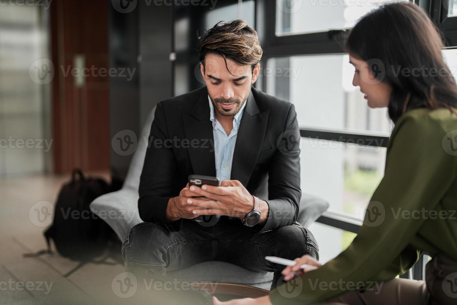 Business people having fun and chatting at workplace office. Male and female colleague enjoy meeting at co working space. colleagues discussing about the project in the office. photo