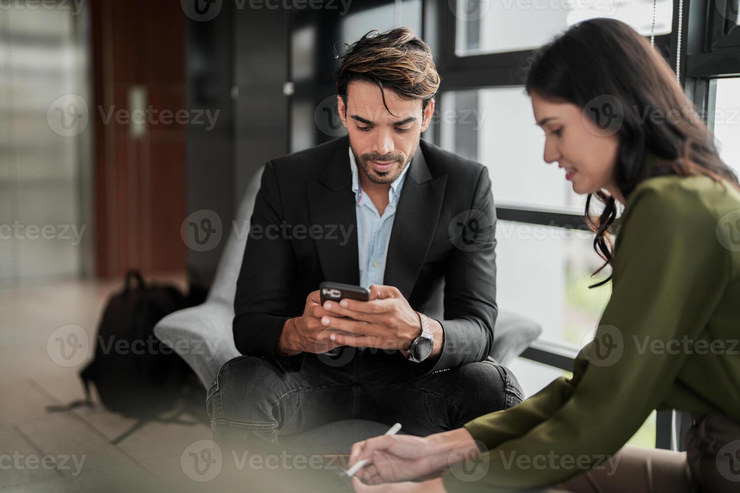 Business people having fun and chatting at workplace office. Male and female colleague enjoy meeting at co working space. colleagues discussing about the project in the office. photo