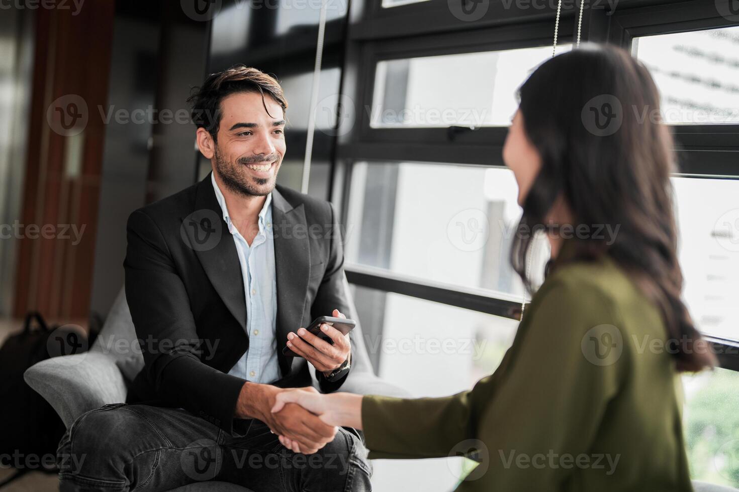 Business people having fun and chatting at workplace office. Male and female colleague enjoy meeting at co working space. colleagues discussing about the project in the office. photo