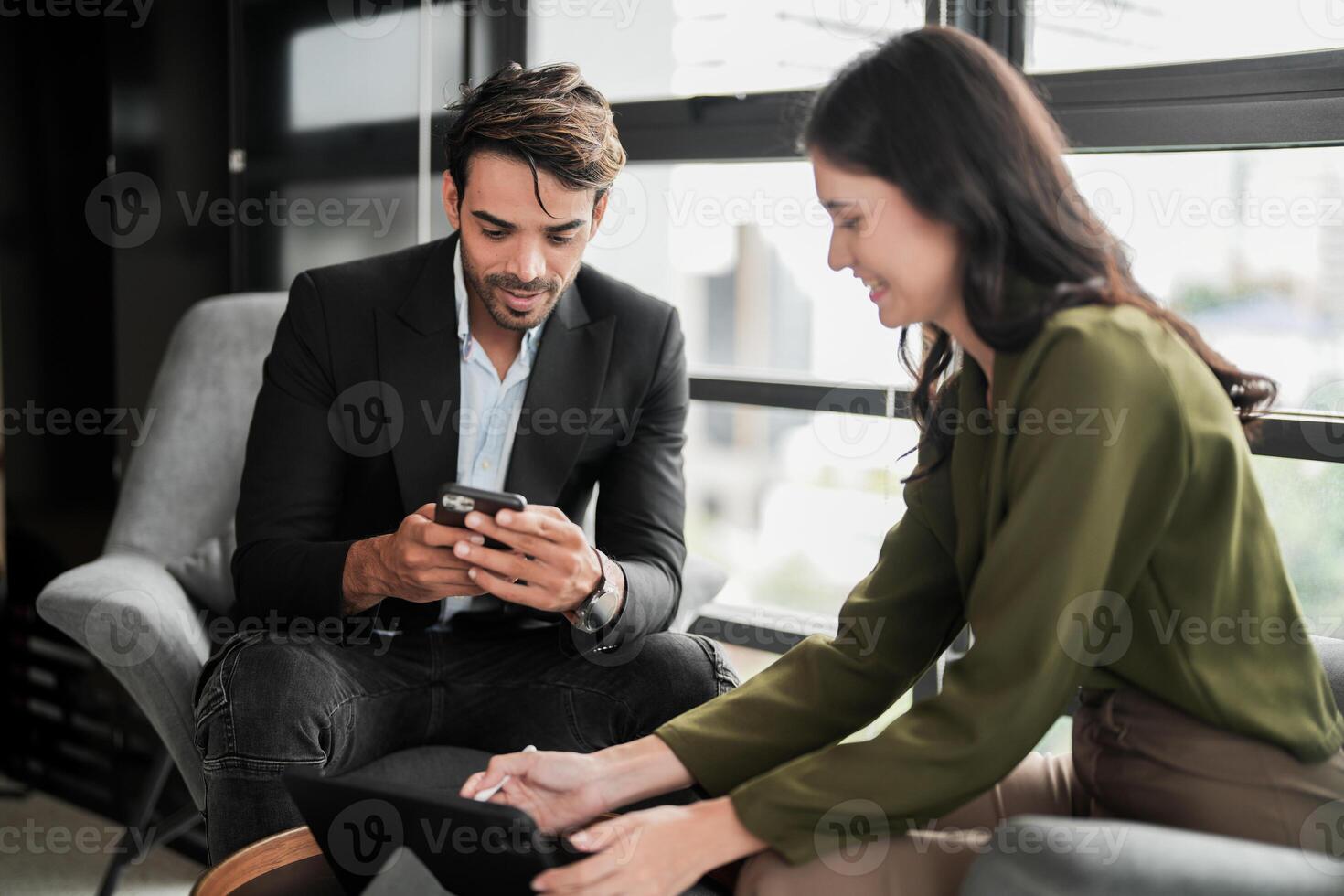 Business people having fun and chatting at workplace office. Male and female colleague enjoy meeting at co working space. colleagues discussing about the project in the office. photo