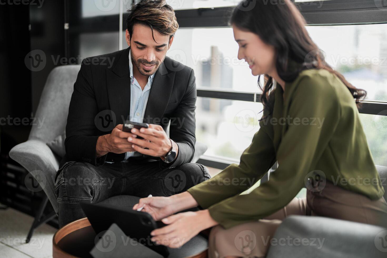Business people having fun and chatting at workplace office. Male and female colleague enjoy meeting at co working space. colleagues discussing about the project in the office. photo