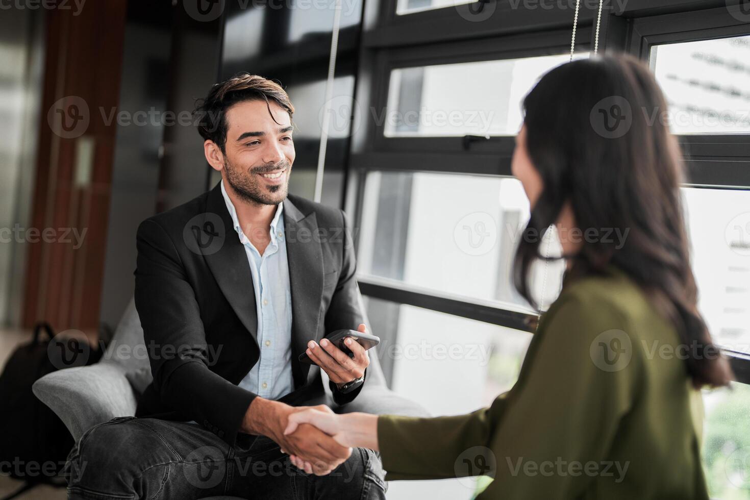 Business people having fun and chatting at workplace office. Male and female colleague enjoy meeting at co working space. colleagues discussing about the project in the office. photo