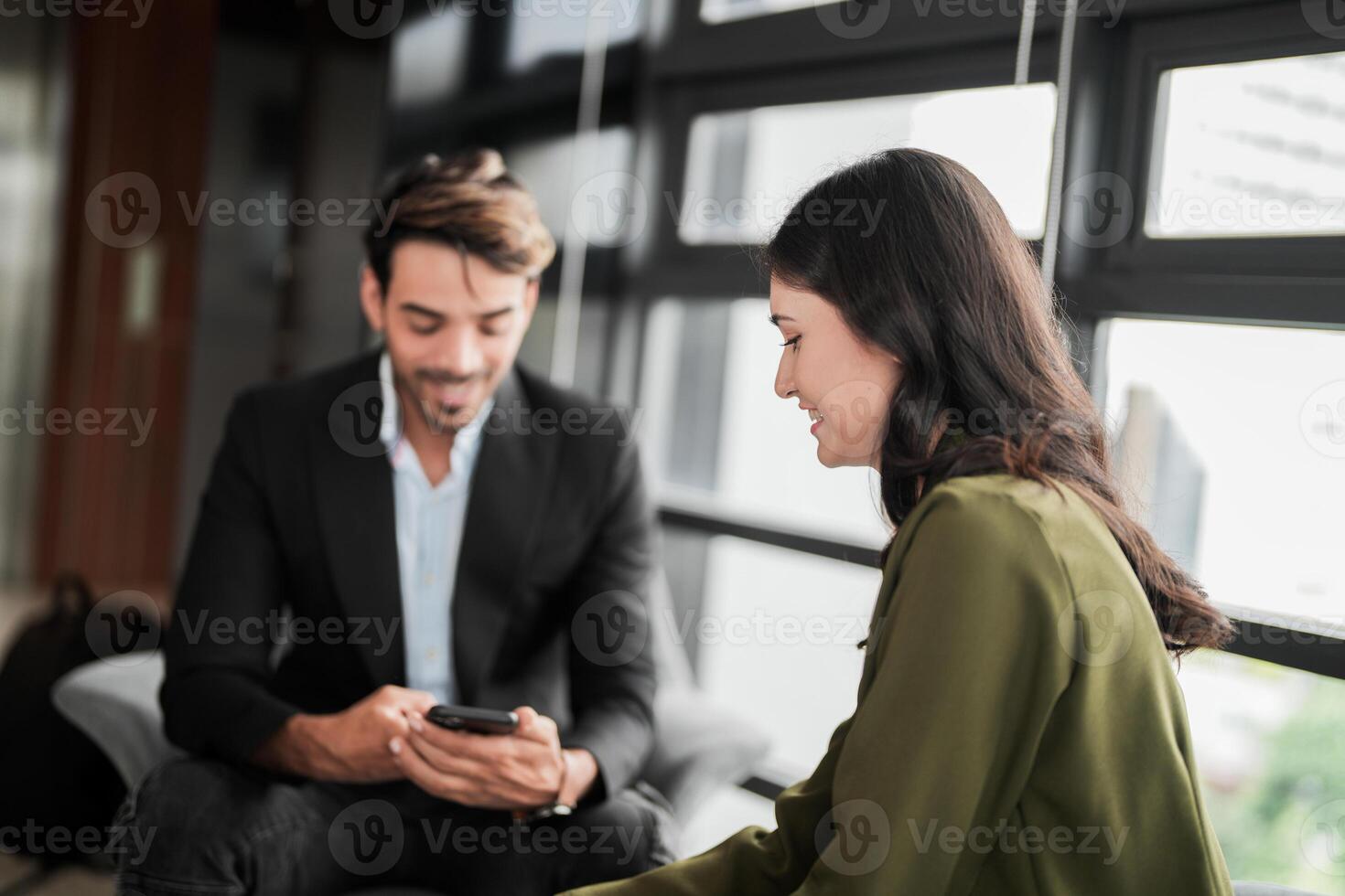 Business people having fun and chatting at workplace office. Male and female colleague enjoy meeting at co working space. colleagues discussing about the project in the office. photo