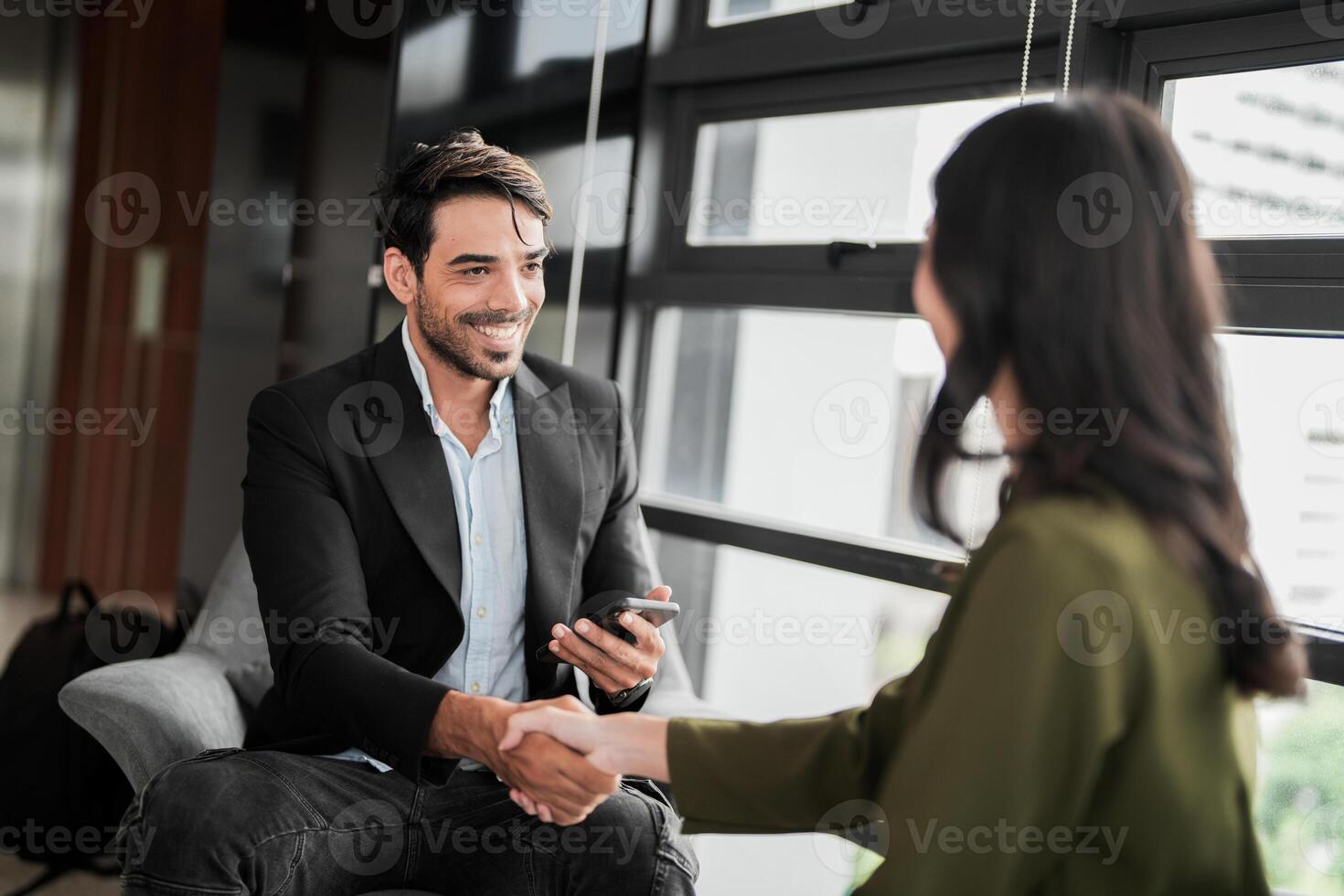 Business people having fun and chatting at workplace office. Male and female colleague enjoy meeting at co working space. colleagues discussing about the project in the office. photo