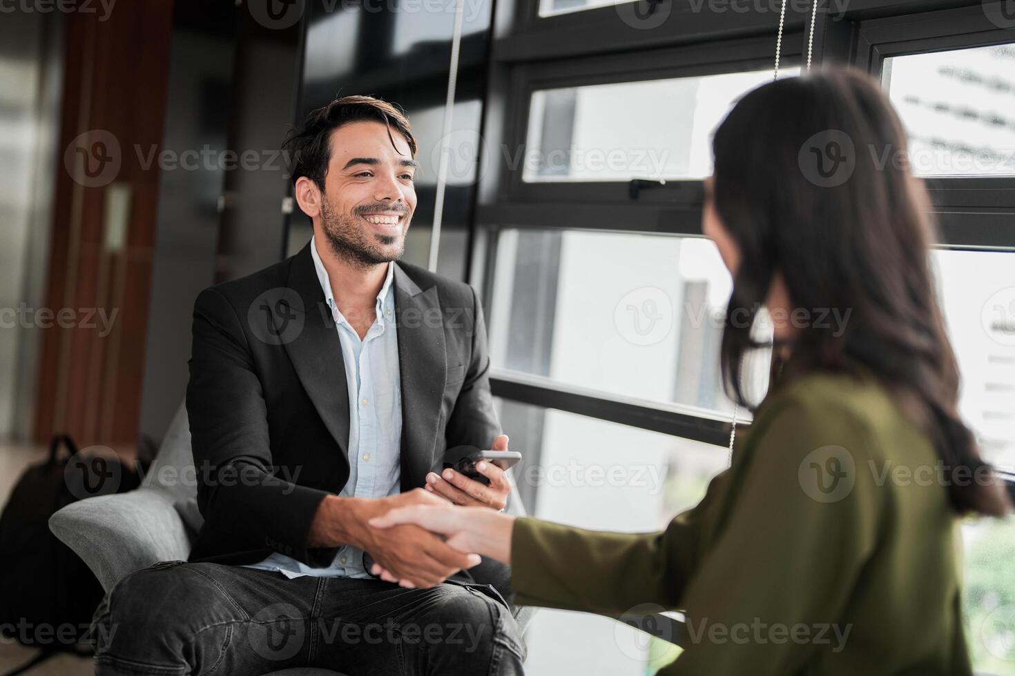 Business people having fun and chatting at workplace office. Male and female colleague enjoy meeting at co working space. colleagues discussing about the project in the office. photo
