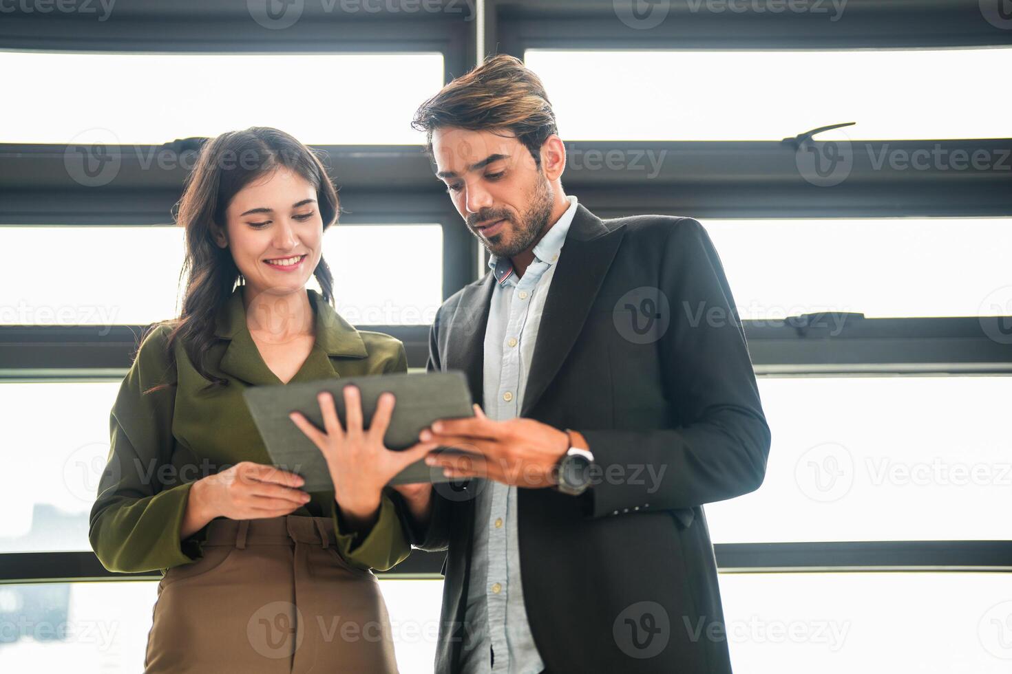 Business people having fun and chatting at workplace office. Male and female colleague enjoy meeting at co working space. colleagues discussing about the project in the office. photo