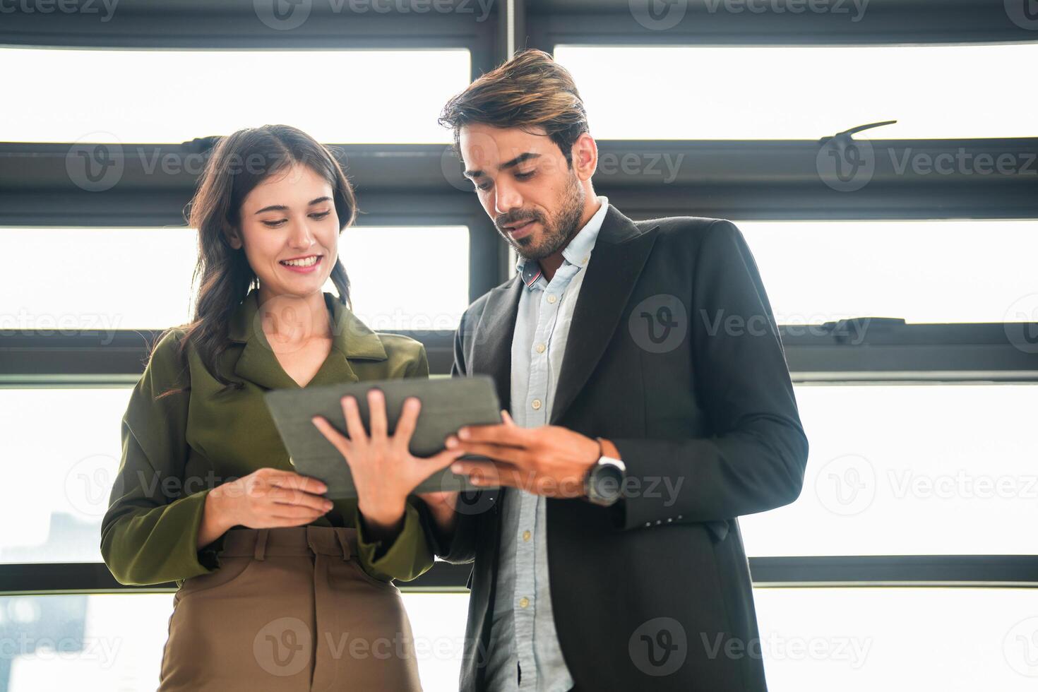 Business people having fun and chatting at workplace office. Male and female colleague enjoy meeting at co working space. colleagues discussing about the project in the office. photo
