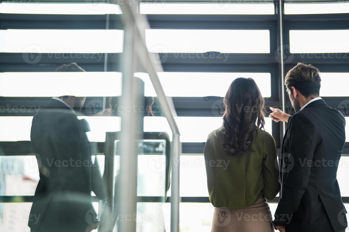 Business people having fun and chatting at workplace office. Male and female colleague enjoy meeting at co working space. colleagues discussing about the project in the office. photo
