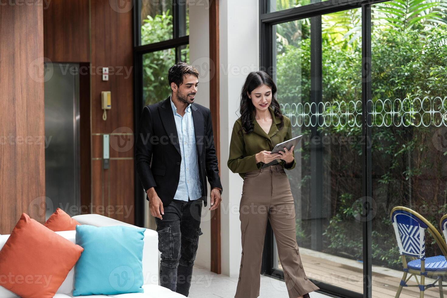 Business people having fun and chatting at workplace office. Male and female colleague enjoy meeting at co working space. colleagues discussing about the project in the office. photo