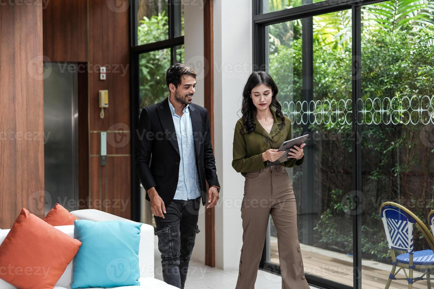 Business people having fun and chatting at workplace office. Male and female colleague enjoy meeting at co working space. colleagues discussing about the project in the office. photo