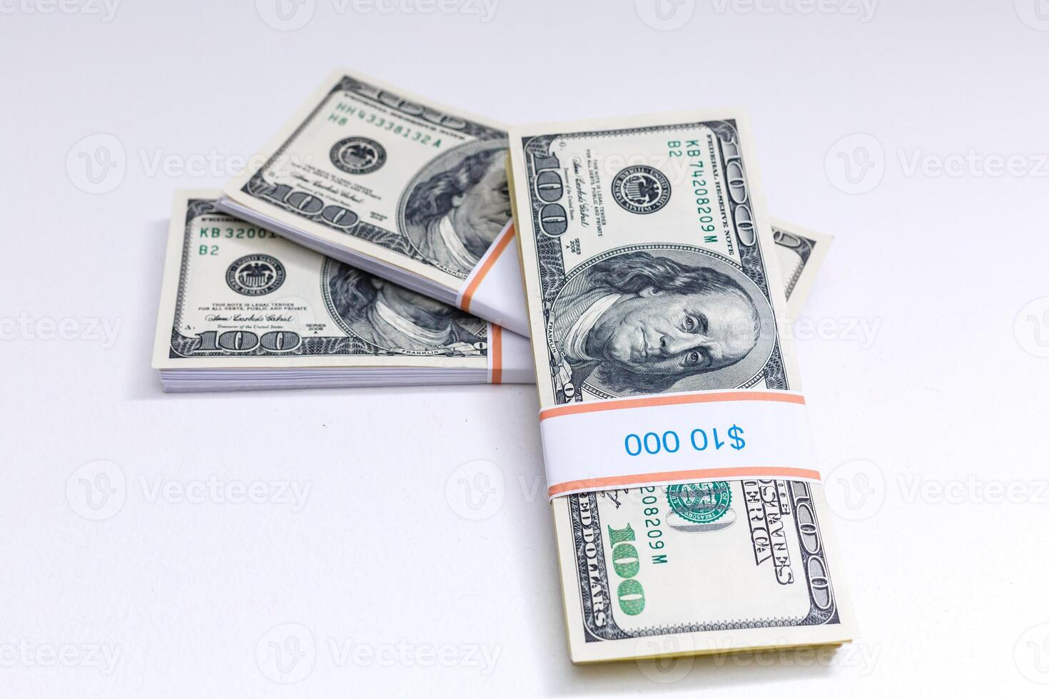 Set of a packs of dollars with a rubber band isolated on a white background photo