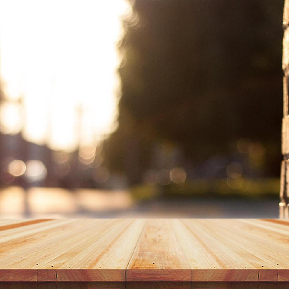 Wooden table top on nature background - can be used for montage or free display of your products photo