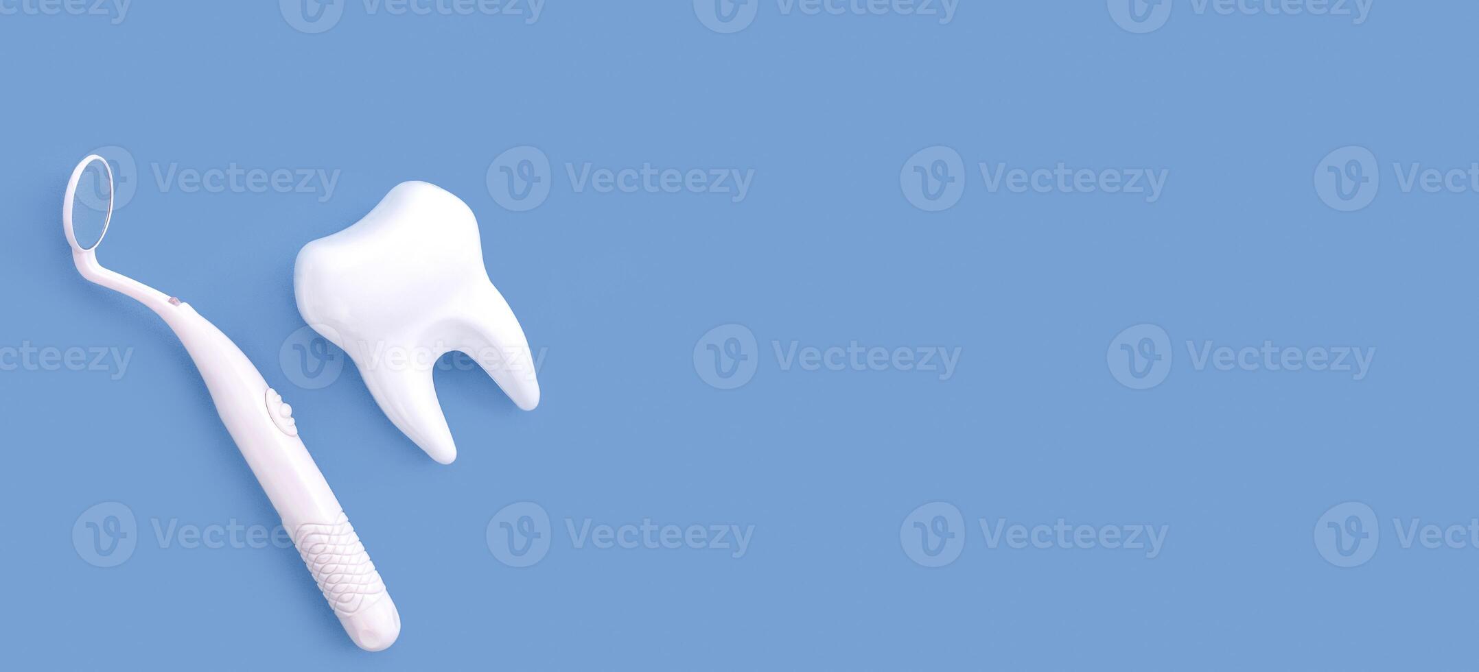 The concept of dentistry. A mirror for examining the oral cavity and a tooth on a blue background. Examination at the dentist. Flat lay, top view.Banner. Copy space. photo