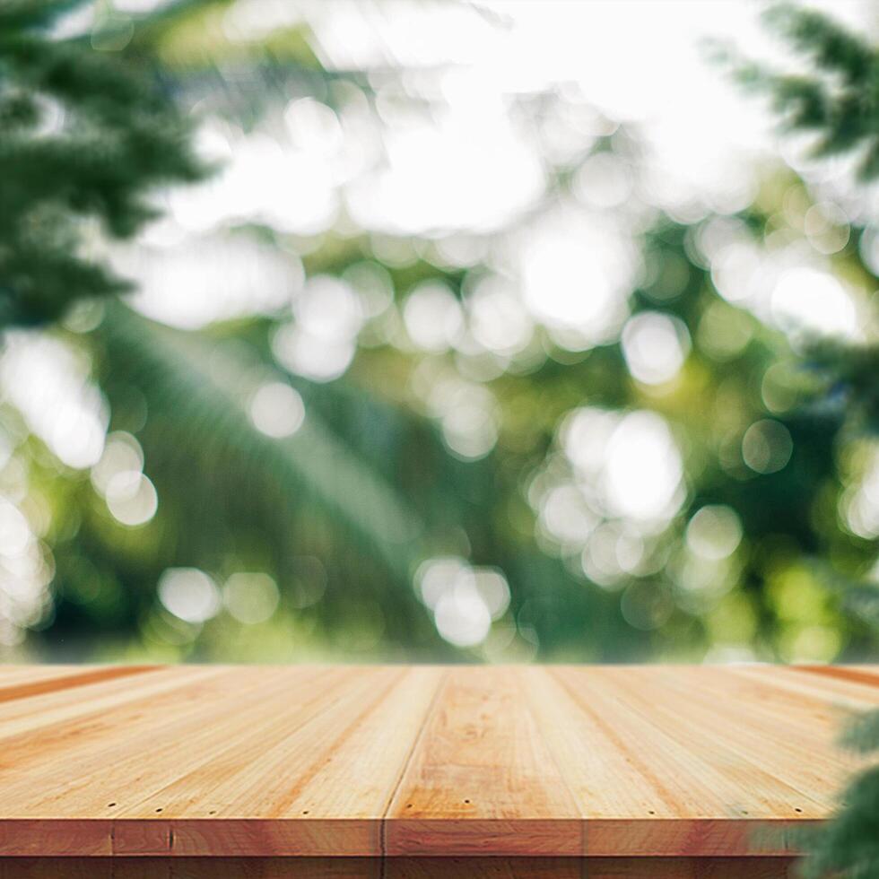 Wooden table top on nature background - can be used for montage or free display of your products photo