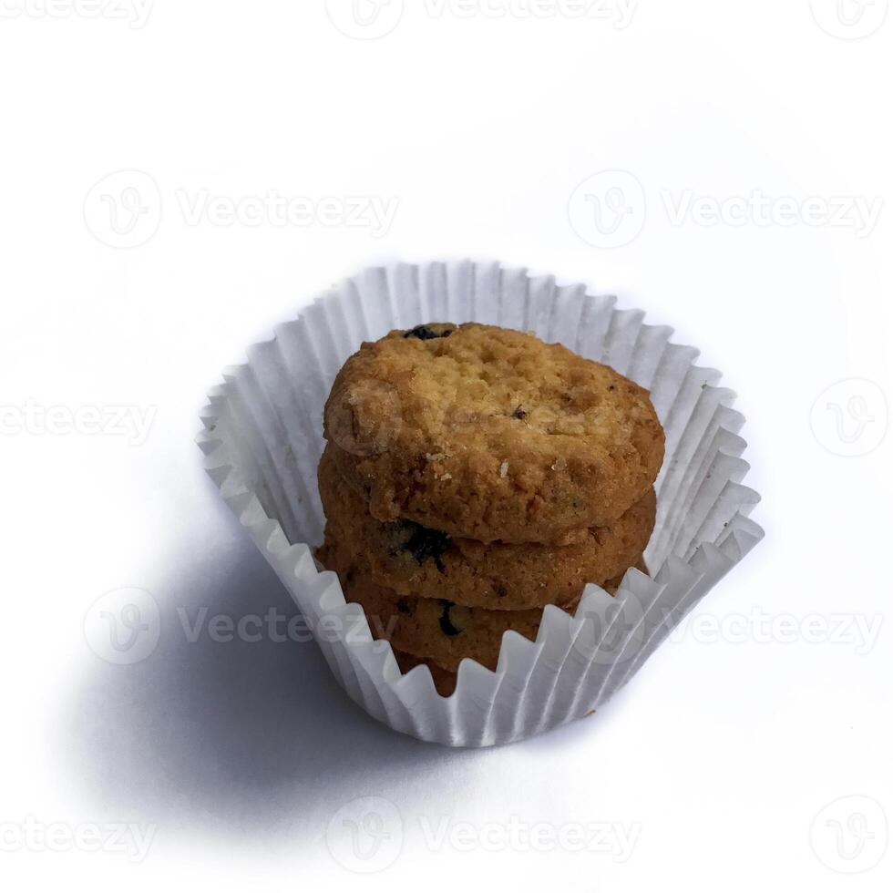 A pile of brownish-colored Cookies isolated on a white background. photo