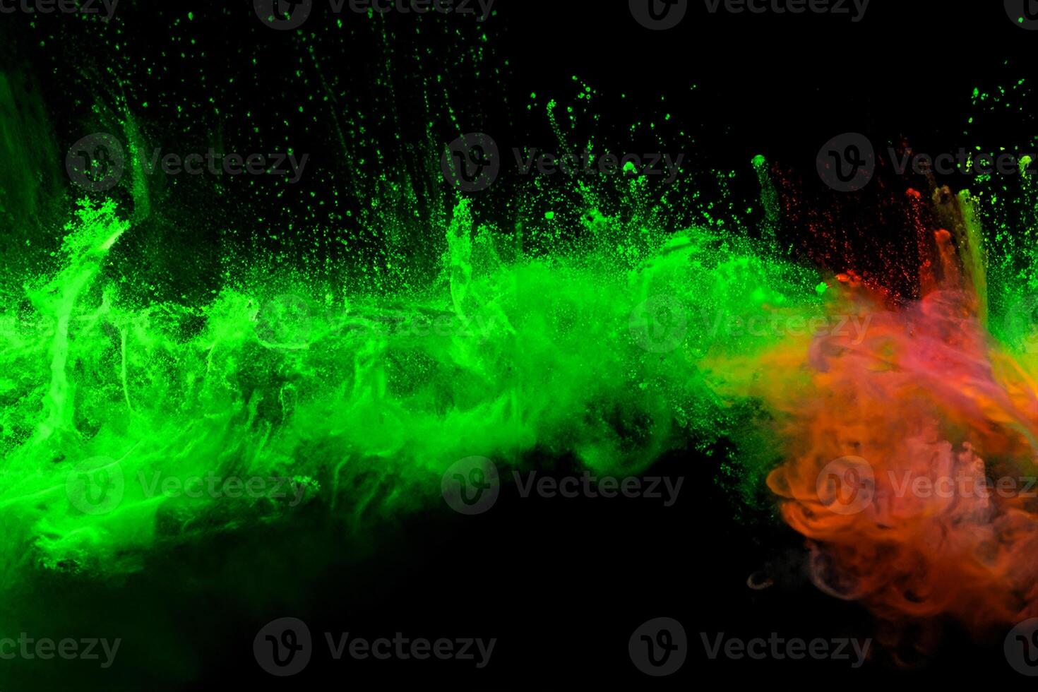 Green color powder explosion cloud on black background.Green dust splash. photo