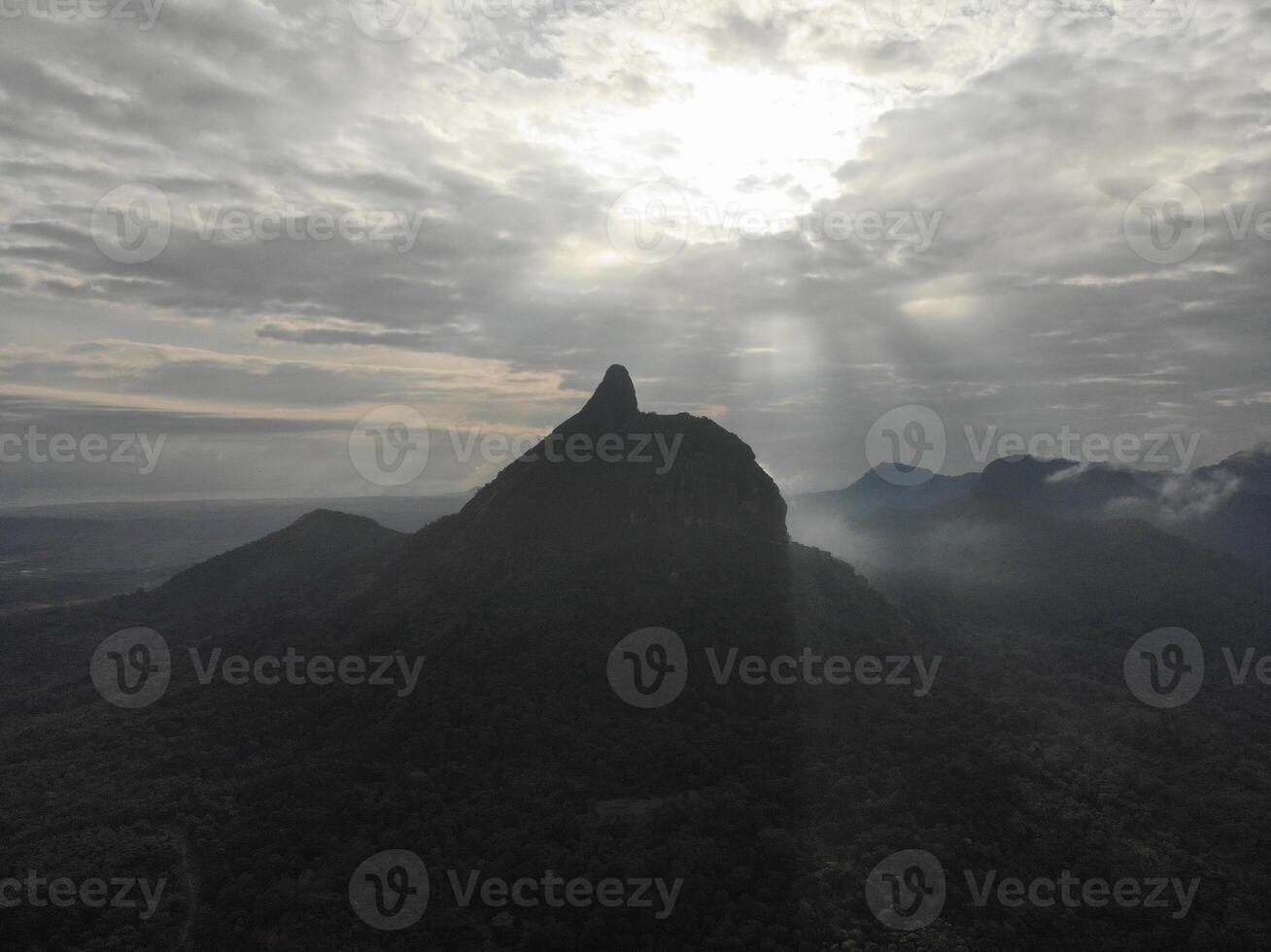 a view of the mountains from a hillside. Serelo Hill is located in Perangai Village, Lahat regency, and it becomes one of popular landmark in Lahat regency. photo