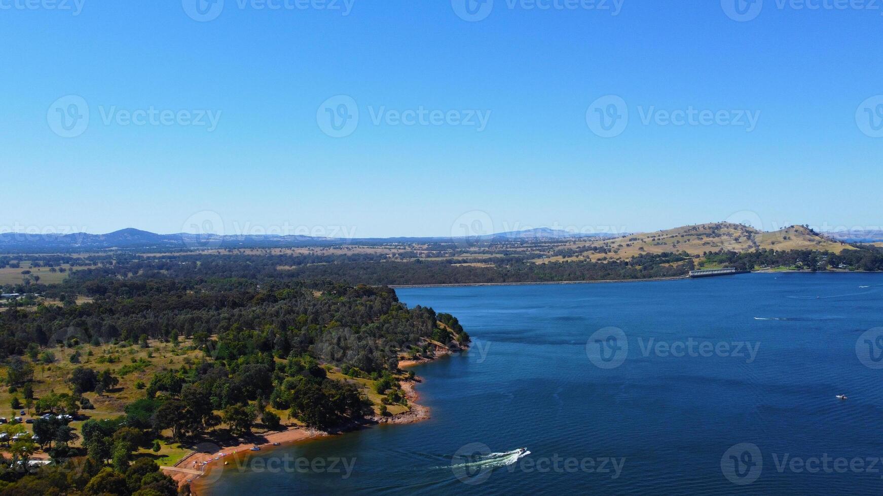Aerial view of Jacksons point Bonegilla Victoria Australia with mountain view and lake hume water held by an awe-inspiring dam wall. photo
