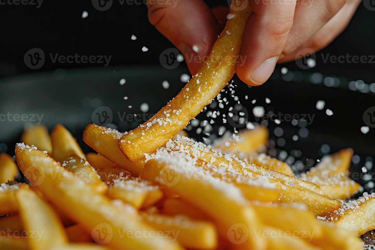 AI generated Detail shot of adding salt on french fries, Close-up. photo