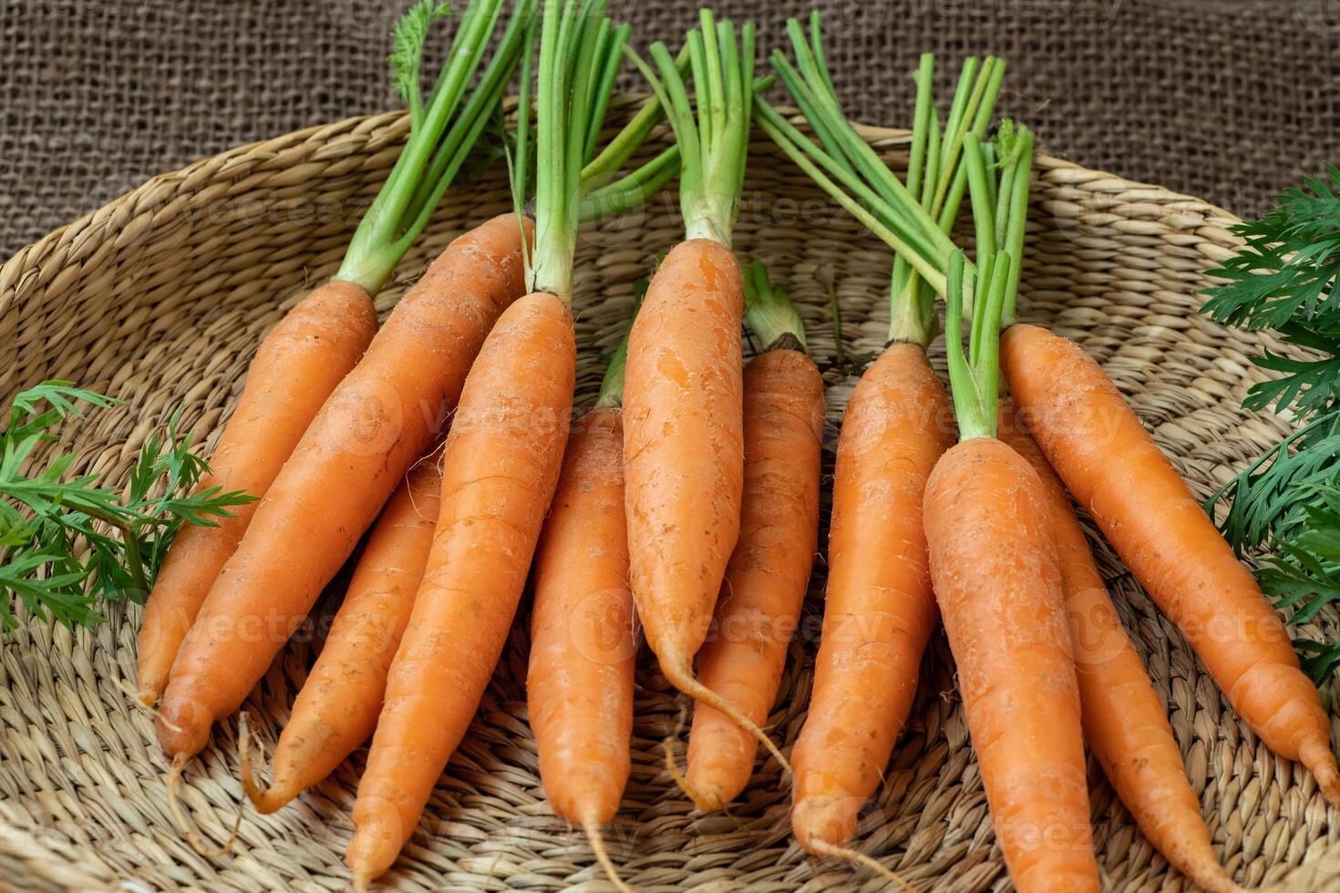 Fresh carrot in a basket, root vegetable. Healthy food photo
