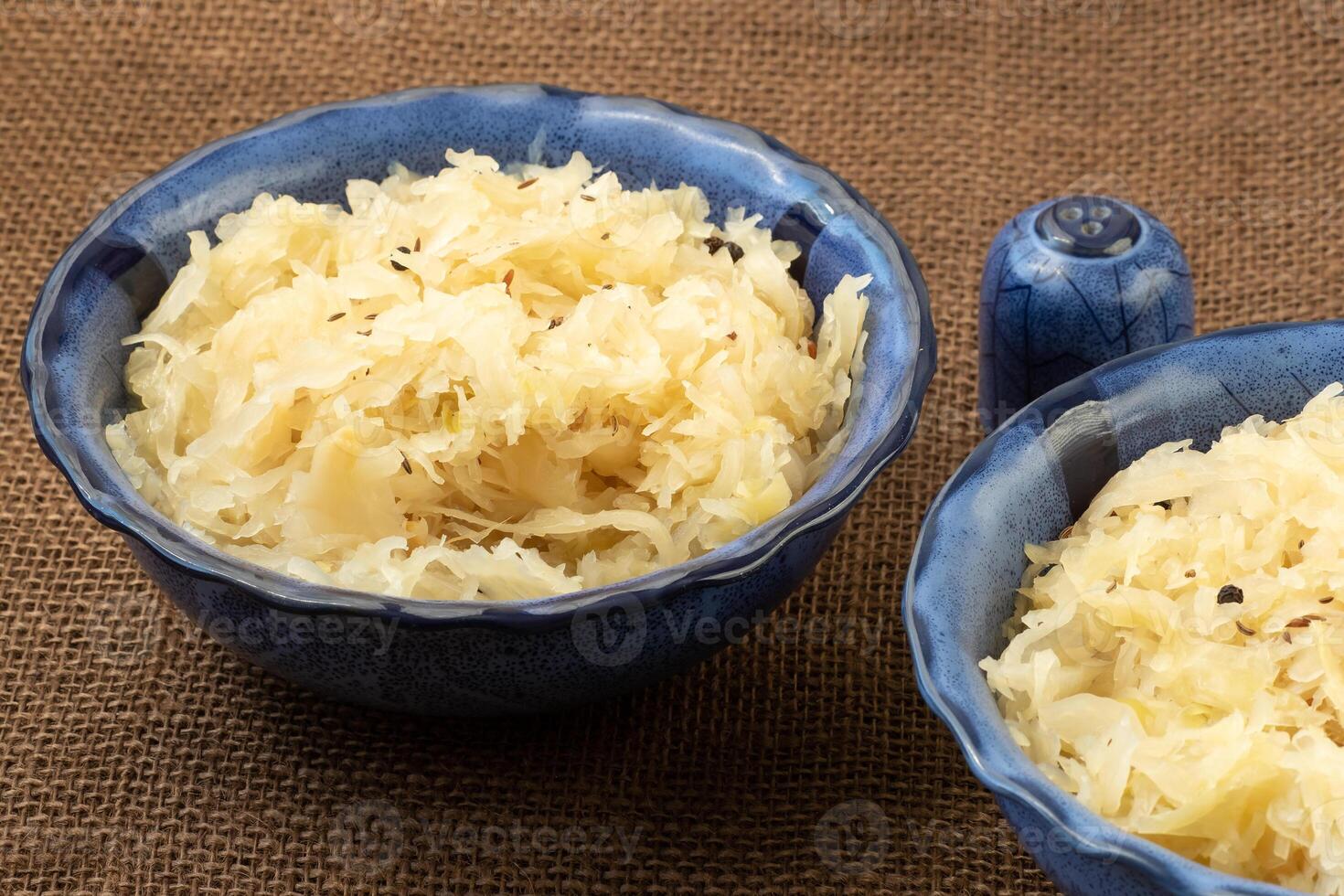 Sauerkraut in a blue bowl. Fresh healthy sauerkraut. photo