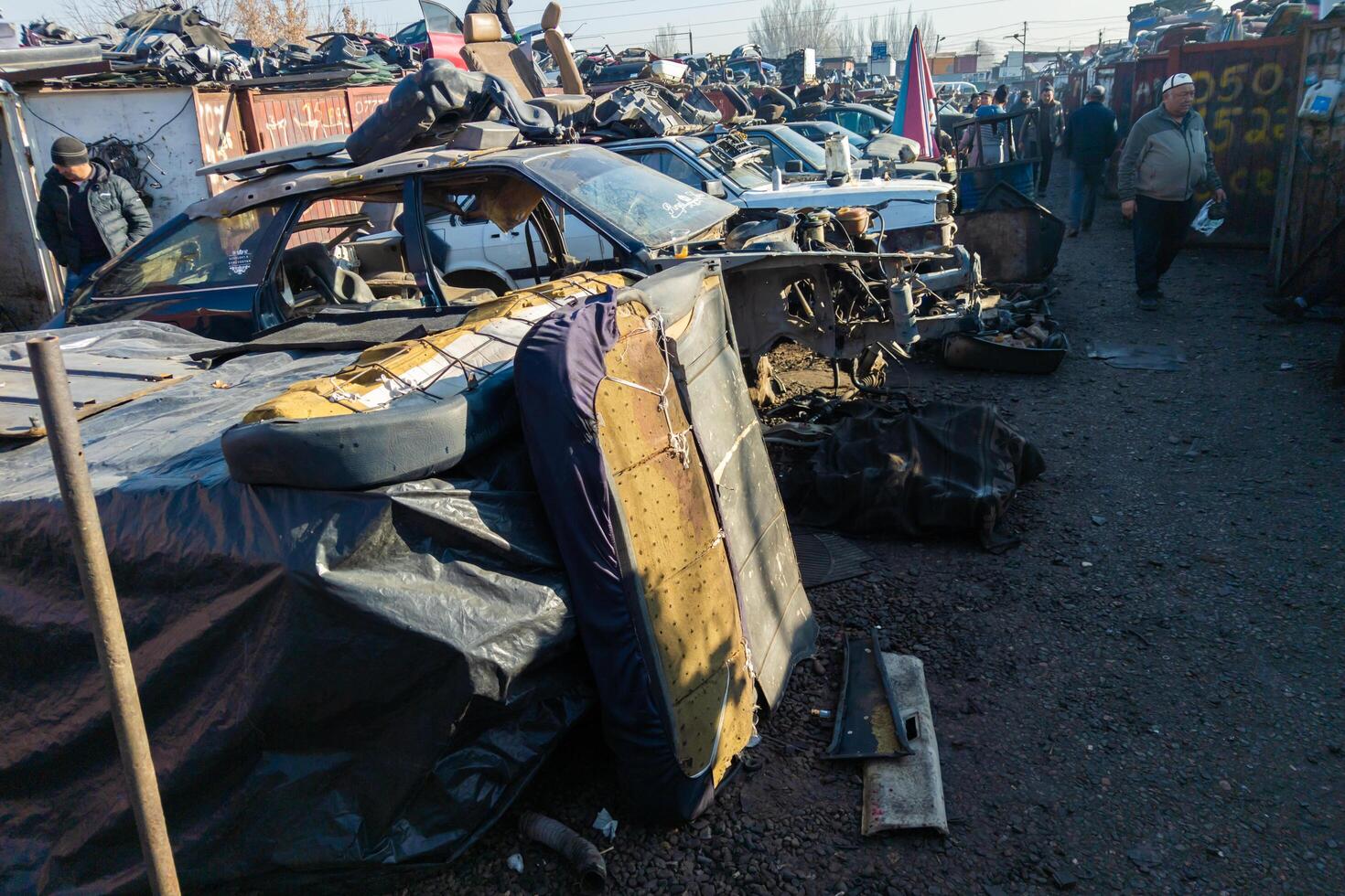car parts at open air junkyard and used spare parts market in Kudaybergen, Bishkek, Kyrgyzstan photo