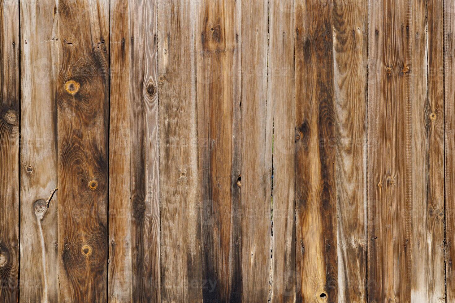 old dry weathered brownish gray wooden planks board surface - full frame background and texture photo