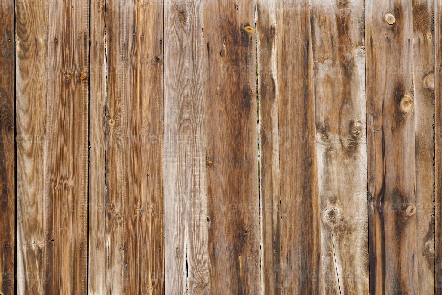 old dry weathered brownish gray wooden planks board surface - full frame background and texture photo