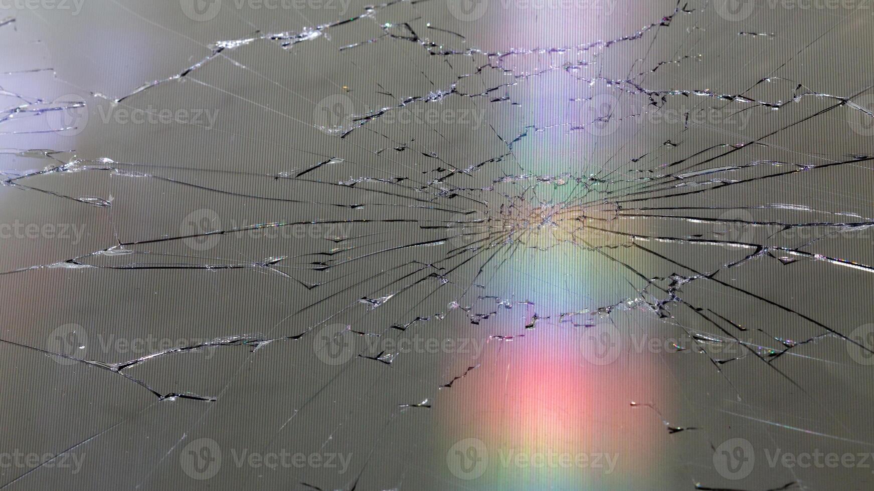 damaged LCD screen with cracks, full-frame background photo