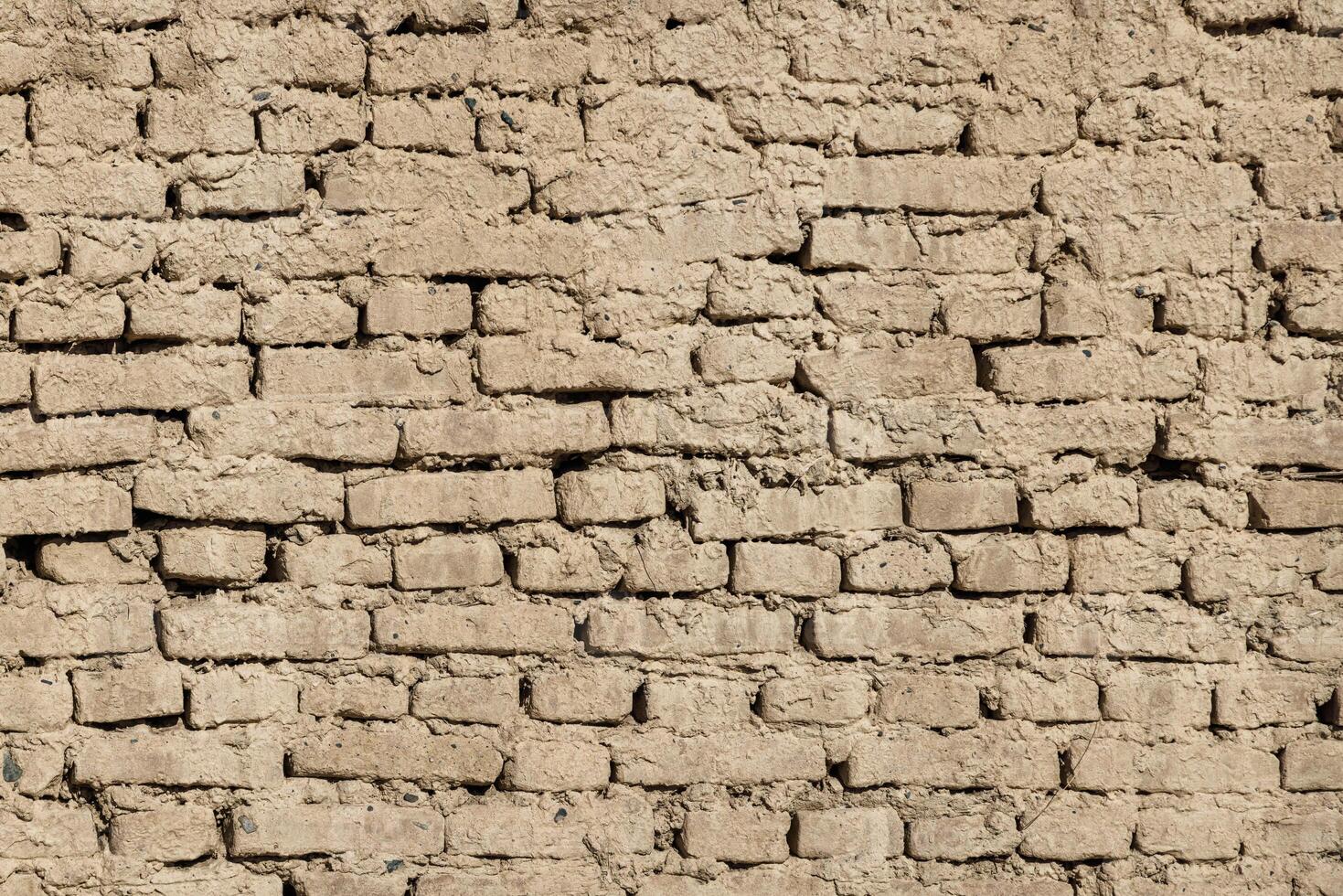 adobe air brick wall flat texture and full frame background photo